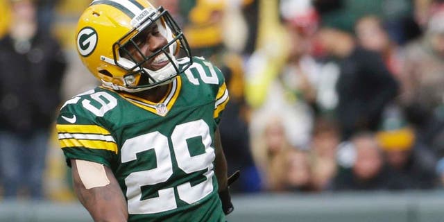 The Green Bay Packers' Casey Hayward celebrates after intercepting a pass during the second half against the Carolina Panthers.