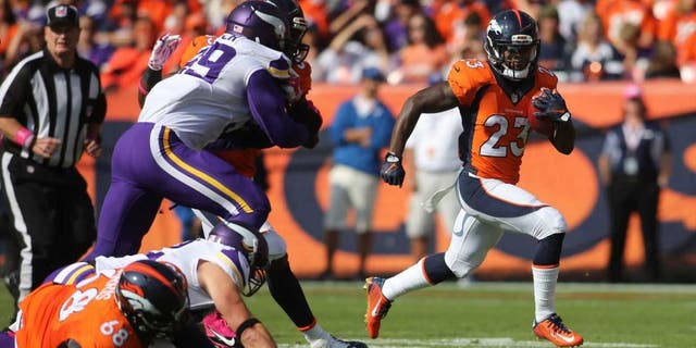 Denver Broncos running back Ronnie Hillman runs for a touchdown during the first half against the Minnesota Vikings at Sports Authority Field at Mile High in Denver on Sunday, Oct. 4, 2015.