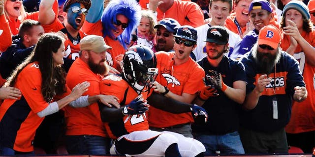Denver Broncos running back Ronnie Hillman celebrates after scoring against the Minnesota Vikings during the first half Sunday, Oct. 4, 2015, in Denver.