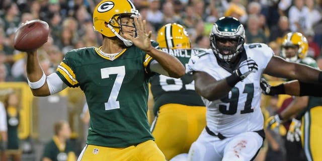 Green Bay Packers quarterback Brett Hundley gets a pass away while under pressure from Philadelphia Eagles defensive end Fletcher Cox in the second quarter of a preseason game at Lambeau Field on Saturday, Aug. 29, 2015.