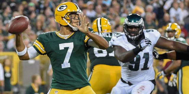 Green Bay Packers quarterback Brett Hundley gets a pass away while under pressure from Philadelphia Eagles defensive end Fletcher Cox in the second quarter of a preseason game at Lambeau Field on Saturday, Aug. 29, 2015.