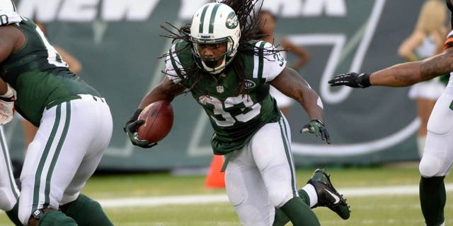 Dec 22, 2013; East Rutherford, NJ, USA; New York Jets running back Chris Ivory runs against the Cleveland Browns during the game at MetLife Stadium. Mandatory Credit: Robert Deutsch-USA TODAY Sports