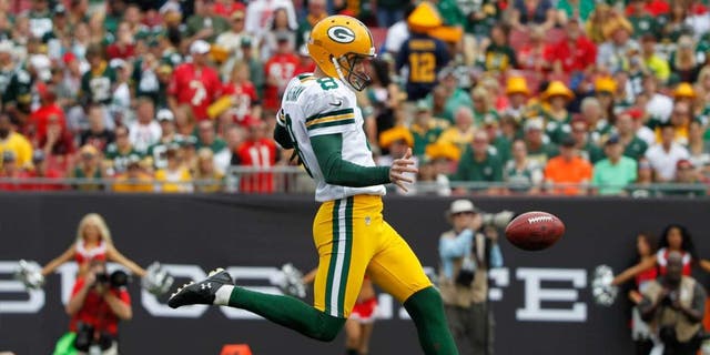 Green Bay Packers punter Tim Masthay punts the ball against the Tampa Bay Buccaneers during the first quarter at Raymond James Stadium on Dec. 21, 2014.