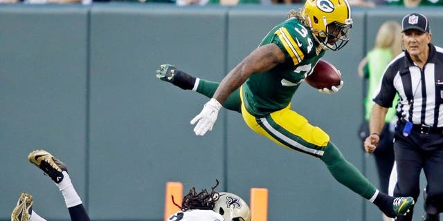 Green Bay Packers' Rajion Neal runs back a kickoff during the first half of an NFL preseason football game against the New Orleans Saints Thursday, Sept. 3, 2015, in Green Bay, Wis. (AP Photo/Jeffrey Phelps)