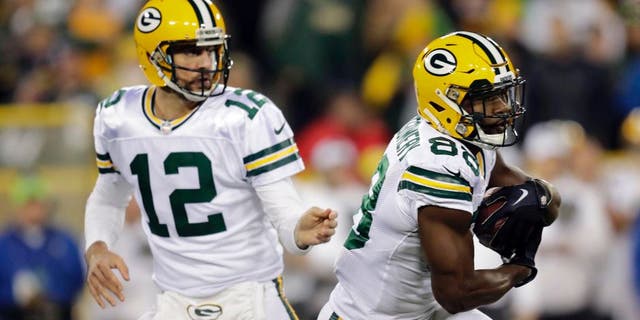 Oct 20, 2016; Green Bay, WI, USA; Green Bay Packers quarterback Aaron Rodgers (12) hands off the ball to wide receiver Ty Montgomery (88) in the first quarter against the Chicago Bears at Lambeau Field. Mandatory Credit: Dan Powers/The Post-Crescent via USA TODAY Sports