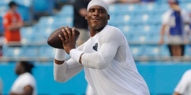 Aug 8, 2014; Charlotte, NC, USA; Carolina Panthers quarterback Cam Newton (1) warms up before the game against the Buffalo Bills at Bank of America Stadium. Mandatory Credit: Sam Sharpe-USA TODAY Sports