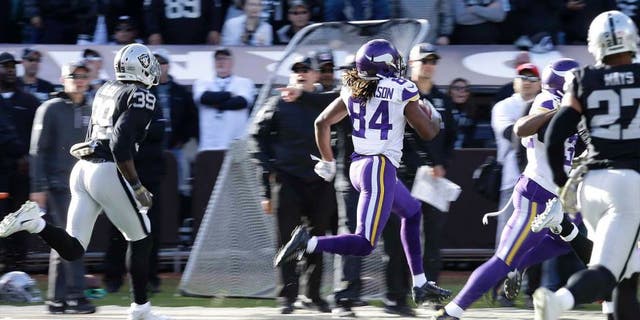 Minnesota Vikings wide receiver Cordarrelle Patterson returns a kickoff for a touchdown against the Oakland Raiders during the first half in Oakland, Calif., on Sunday, Nov. 15, 2015.