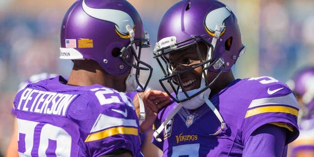 Minnesota Vikings quarterback Teddy Bridgewater and running back Adrian Peterson smile before the game the San Diego Chargers at TCF Bank Stadium in Minneapolis on Sunday, Sept. 27, 2015.