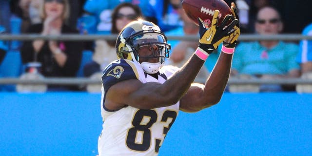Oct 20, 2013; Charlotte, NC, USA; St. Louis Rams wide receiver Brian Quick (83) drops a pass in the end zone as Carolina Panthers cornerback Melvin White (23) defends in the fourth quarter. The Carolina Panthers defeated the St. Louis Rams 30-15 at Bank of America Stadium. Mandatory Credit: Bob Donnan-USA TODAY Sports