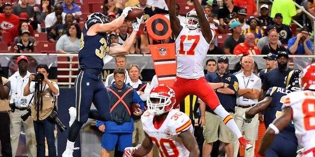 Sep 3, 2015; St. Louis, MO, USA; St. Louis Rams defensive back Cody Davis (38) intercepts a pass thrown by Kansas City Chiefs quarterback Chase Daniel (not pictured) and runs the ball back for a touch down during the first half at the Edward Jones Dome. Mandatory Credit: Jasen Vinlove-USA TODAY Sports