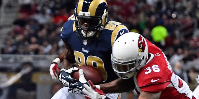 Dec 11, 2014; St. Louis, MO, USA; Arizona Cardinals strong safety Deone Bucannon (36) brings down St. Louis Rams tight end Jared Cook (89) during the first half at the Edward Jones Dome. Mandatory Credit: Jasen Vinlove-USA TODAY Sports
