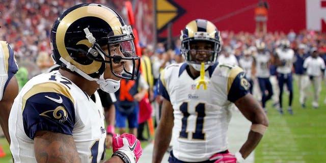 St. Louis Rams wide receiver Stedman Bailey (12) celebrates his touchdown receptions with teammates Kenny Britt (18) and Tavon Austin (11) during the second half of an NFL football game against the Arizona Cardinals, Sunday, Oct. 4, 2015, in Glendale, Ariz. (AP Photo/Ross D. Franklin)