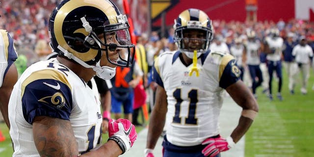 St. Louis Rams wide receiver Stedman Bailey (12) celebrates his touchdown receptions with teammates Kenny Britt (18) and Tavon Austin (11) during the second half of an NFL football game against the Arizona Cardinals, Sunday, Oct. 4, 2015, in Glendale, Ariz. (AP Photo/Ross D. Franklin)
