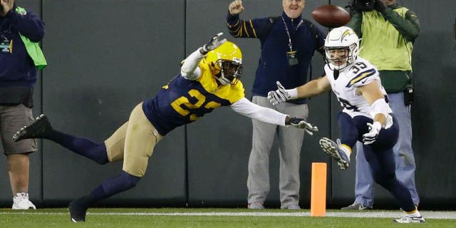 The Green Bay Packers' Damarious Randall (left) deflects a pass intended for the San Diego Chargers' Danny Woodhead on the final play of an NFL game, Sunday, Oct. 18, 2015, in Green Bay, Wis. The Packers won 27-20.