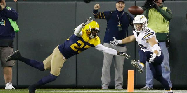 The Green Bay Packers' Damarious Randall (left) deflects a pass intended for the San Diego Chargers' Danny Woodhead on the final play of an NFL game, Sunday, Oct. 18, 2015, in Green Bay, Wis. The Packers won 27-20.