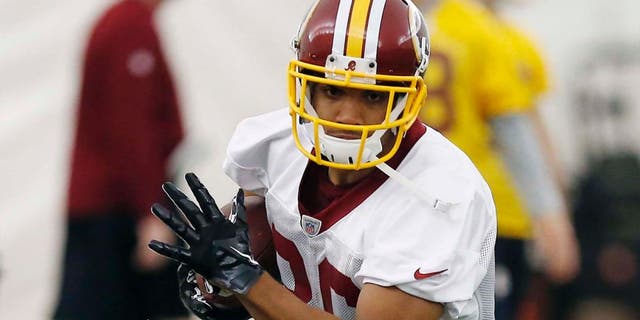 May 29, 2014; Ashburn, VA, USA; Washington Redskins tight end Jordan Reed (86) runs with the ball during organized team activities at Redskins Park.