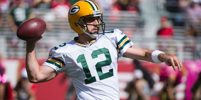 Green Bay Packers quarterback Aaron Rodgers passes the football against the San Francisco 49ers during the first quarter at Levi's Stadium in Santa Clara, Calif., on Sunday, Oct. 4, 2015.