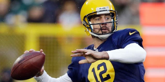 The Green Bay Packers' Aaron Rodgers throws during the first half against the Philadelphia Eagles in Green Bay, Wis.