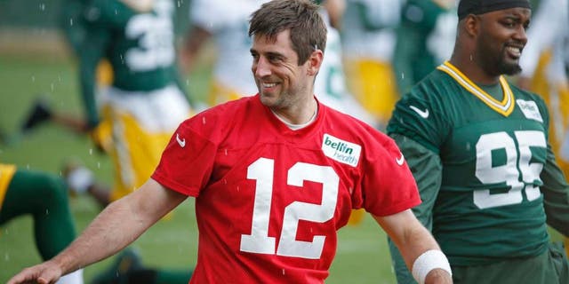 Green Bay Packers quarterback Aaron Rodgers stretches during a practice Monday June 6, 2016, in Green Bay, Wis.