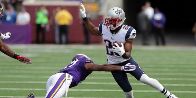 New England Patriots cornerback Logan Ryan (right) tries to avoid Minnesota Vikings wide receiver Jarius Wright after intercepting a pass during the third quarter.