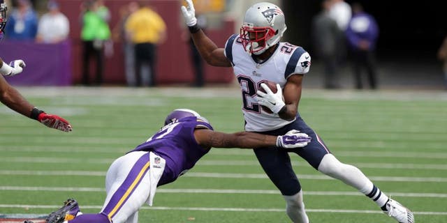 New England Patriots cornerback Logan Ryan (right) tries to avoid Minnesota Vikings wide receiver Jarius Wright after intercepting a pass during the third quarter.