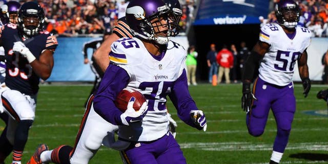 Minnesota Vikings cornerback Marcus Sherels returns a punt for a touchdown against the Chicago Bears during the first half at Soldier Field in Chicago on Sunday, Nov. 1, 2015.