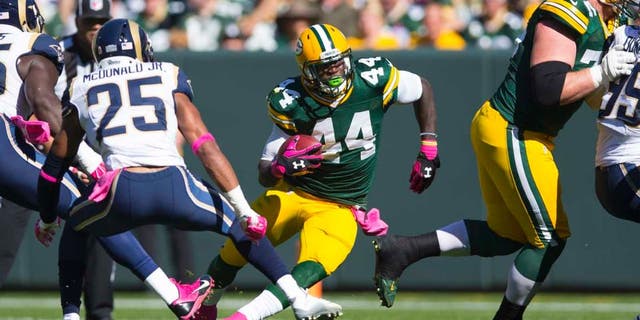 Green Bay Packers running back James Starks rushes with the football during the first quarter against the St. Louis Rams at Lambeau Field in Green Bay, Wis., on Sunday, Oct. 11, 2015.