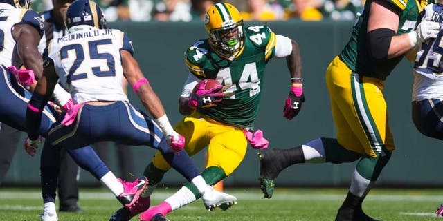 Green Bay Packers running back James Starks rushes with the football during the first quarter against the St. Louis Rams at Lambeau Field in Green Bay, Wis., on Sunday, Oct. 11, 2015.