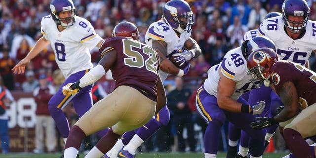 Minnesota Vikings running back Matt Asiata (44) carries the ball past Washington Redskins linebacker Terence Garvin (52) for a touchdown during the first half of an NFL football game in Landover, Md., Sunday, Nov. 13, 2016. (AP Photo/Alex Brandon)