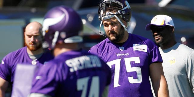 Minnesota Vikings tackle Matt Kalil (75) listens to a coach during NFL football minicamp in Eden Prairie, Minn., Tuesday, June 16, 2015. (AP Photo/Ann Heisenfelt)