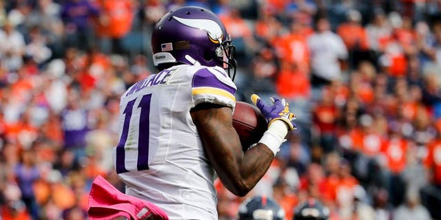 Minnesota Vikings wide receiver Mike Wallace catches a touchdown pass during the first half against the Denver Broncos on Sunday, Oct. 4, 2015, in Denver.