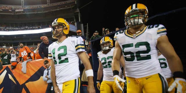 Green Bay Packers quarterback Aaron Rodgers (left) and inside linebacker Clay Matthews exit the tunnel before the game against the Denver Broncos at Sports Authority Field at Mile High in Denver on Sunday, Nov. 1, 2015.