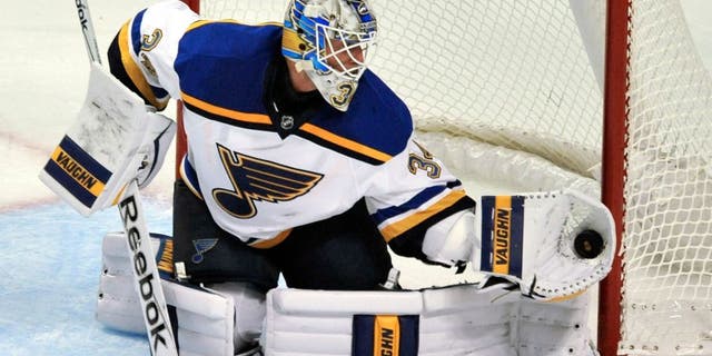 St. Louis Blues goalie Jake Allen (34) makes a save during the second period of a preseason NHL hockey game against the Chicago Blackhawks on Saturday, Sept. 26, 2015, in Chicago. (AP Photo/Paul Beaty)