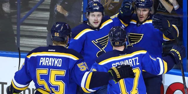 May 15, 2016; St. Louis, MO, USA; St. Louis Blues center Jori Lehtera (12) is congratulated by right wing Vladimir Tarasenko (91) and left wing Jaden Schwartz (17) and defenseman Colton Parayko (55) after scoring a goal against San Jose Sharks goalie Martin Jones (not pictured) during the second period in game one of the Western Conference Final of the 2016 Stanley Cup Playoffs at Scottrade Center. Mandatory Credit: Billy Hurst-USA TODAY Sports
