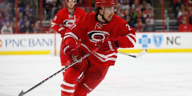 Dec 20, 2014; Raleigh, NC, USA; Carolina Hurricanes defensemen Justin Faulk (27) skates against the New York Rangers at PNC Arena. The New York Rangers defeated the Carolina Hurricanes 3-2 in the shoot out. Mandatory Credit: James Guillory-USA TODAY Sports
