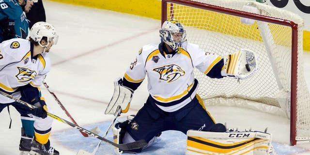 May 12, 2016; San Jose, CA, USA; Nashville Predators goalie Pekka Rinne (35) makes a save against San Jose Sharks center Tomas Hertl (48) in the second period in game seven of the second round of the 2016 Stanley Cup Playoffs at SAP Center at San Jose. Mandatory Credit: Neville E. Guard-USA TODAY Sports