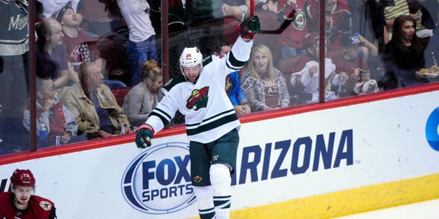 Oct 15, 2015; Glendale, AZ, USA; Minnesota Wild left wing Thomas Vanek (26) celebrates after scoring a goal in the first period against the Arizona Coyotes at Gila River Arena. Mandatory Credit: Matt Kartozian-USA TODAY Sports