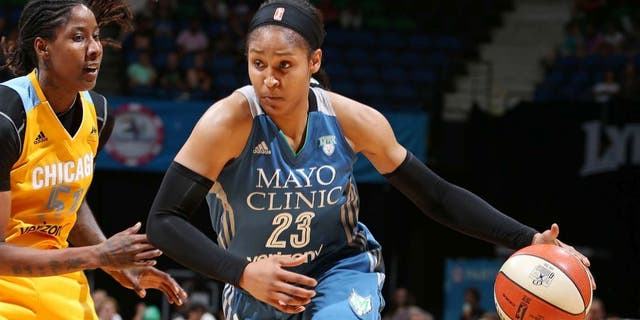 MINNEAPOLIS, MN - JULY 5: Maya Moore #23 of the Minnesota Lynx drives to the basket against Jessica Breland #51 of the Chicago Sky on July 5, 2016 at Target Center in Minneapolis, Minnesota. NOTE TO USER: User expressly acknowledges and agrees that, by downloading and or using this Photograph, user is consenting to the terms and conditions of the Getty Images License Agreement. Mandatory Copyright Notice: Copyright 2016 NBAE (Photo by David Sherman/NBAE via Getty Images)