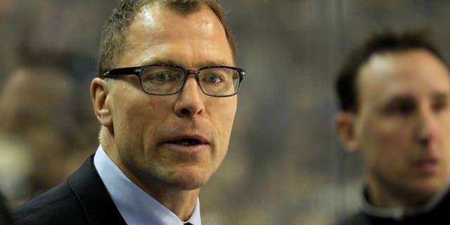 Mar. 2, 2013; Buffalo, NY, USA; New Jersey Devils assistant coach Scott Stevens on the bench against the Buffalo Sabres at First Niagara Center. Mandatory Credit: Timothy T. Ludwig-USA TODAY Sports