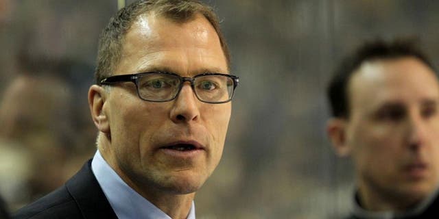 Mar. 2, 2013; Buffalo, NY, USA; New Jersey Devils assistant coach Scott Stevens on the bench against the Buffalo Sabres at First Niagara Center. Mandatory Credit: Timothy T. Ludwig-USA TODAY Sports
