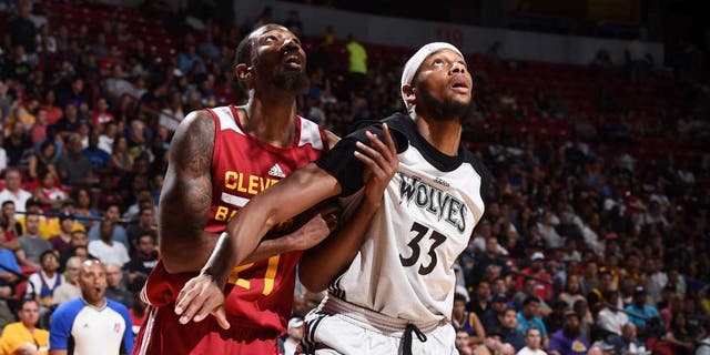 LAS VEGAS, NV - JULY 11: Cory Jefferson #21 of the Cleveland Cavaliers fights for position against Adreian Payne #33 of the Minnesota Timberwolves during the 2016 NBA Las Vegas Summer League on July 11, 2016 at The Thomas &amp; Mack Center in Las Vegas, Nevada. NOTE TO USER: User expressly acknowledges and agrees that, by downloading and or using this photograph, user is consenting to the terms and conditions of Getty Images License Agreement. Mandatory Copyright Notice: Copyright 2016 NBAE (Photo by Garrett Ellwood/NBAE via Getty Images)