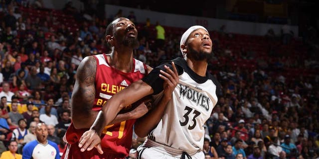 LAS VEGAS, NV - JULY 11: Cory Jefferson #21 of the Cleveland Cavaliers fights for position against Adreian Payne #33 of the Minnesota Timberwolves during the 2016 NBA Las Vegas Summer League on July 11, 2016 at The Thomas & Mack Center in Las Vegas, Nevada. NOTE TO USER: User expressly acknowledges and agrees that, by downloading and or using this photograph, user is consenting to the terms and conditions of Getty Images License Agreement. Mandatory Copyright Notice: Copyright 2016 NBAE (Photo by Garrett Ellwood/NBAE via Getty Images)