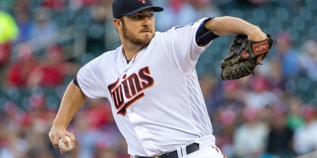 Minnesota Twins starting pitcher Phil Hughes delivers a pitch in the first inning against the Tampa Bay Rays.