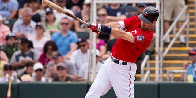 Mar 20, 2016; Fort Myers, FL, USA; Minnesota Twins first baseman Joe Mauer (7) bats against the New York Yankees during the game at CenturyLink Sports Complex. The Yankees defeat the Twins 6-4. Mandatory Credit: Jerome Miron-USA TODAY Sports