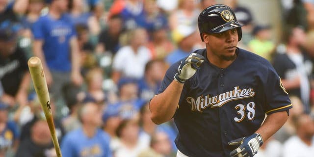 Jun 11, 2016; Milwaukee, WI, USA; Milwaukee Brewers pitcher Wily Peralta (38) flips his bat after hitting a two run home run in the fourth inning against the New York Mets at Miller Park. Mandatory Credit: Benny Sieu-USA TODAY Sports