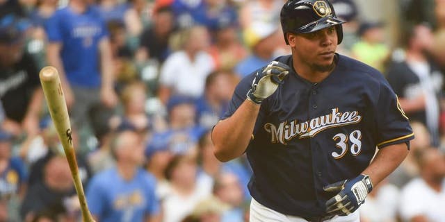 Jun 11, 2016; Milwaukee, WI, USA; Milwaukee Brewers pitcher Wily Peralta (38) flips his bat after hitting a two run home run in the fourth inning against the New York Mets at Miller Park. Mandatory Credit: Benny Sieu-USA TODAY Sports