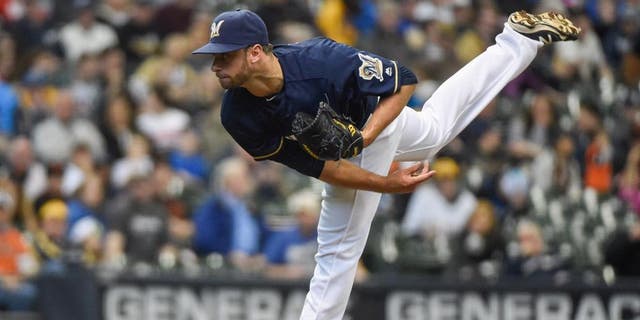 Apr 6, 2016; Milwaukee, WI, USA; Milwaukee Brewers pitcher Tyler Thornburg (37) pitched an inning of scoreless relief against the San Francisco Giants at Miller Park. Thornburg picked up the win as the Brewers beat the Giants 4-3. Mandatory Credit: Benny Sieu-USA TODAY Sports