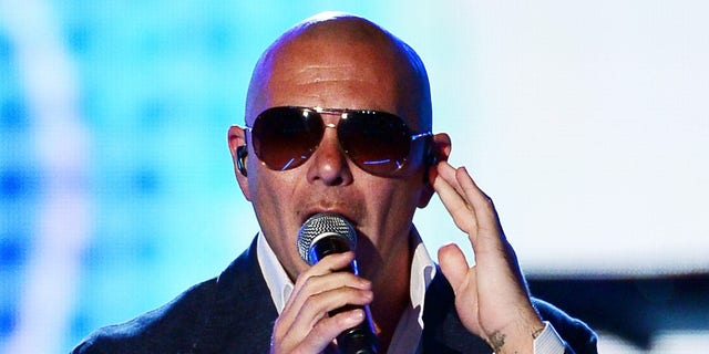 LAS VEGAS, NV - APRIL 08:  Recording artist Pitbull performs onstage during Tim McGraw's Superstar Summer Night presented by the Academy of Country Music at the MGM Grand Garden Arena on April 8, 2013 in Las Vegas, Nevada.  (Photo by Ethan Miller/Getty Images)