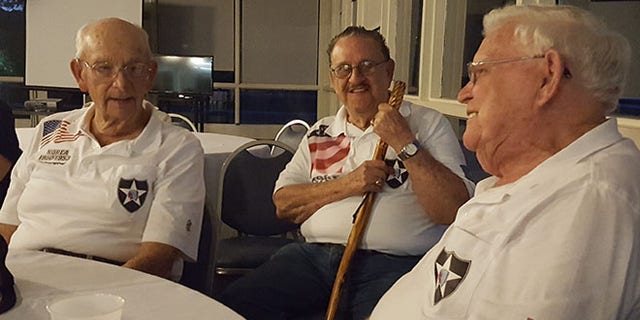 Robertson, Diaz and Duke reminisce on their time together in the Army, wearing matching shirts made by a wife of one of their fellow veterans.