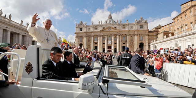 Pope Francis waves to faithful as leaves at the end of a jubilee mass he celebrated in St. Peter's Square, at the Vatican, Sunday, Oct. 9, 2016. Pope Francis has named 17 new cardinals _ 13 of them under age 80 and thus eligible to vote in a conclave to elect his successor. (AP Photo/Andrew Medichini)